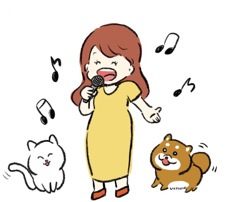 歌っている女と犬と猫